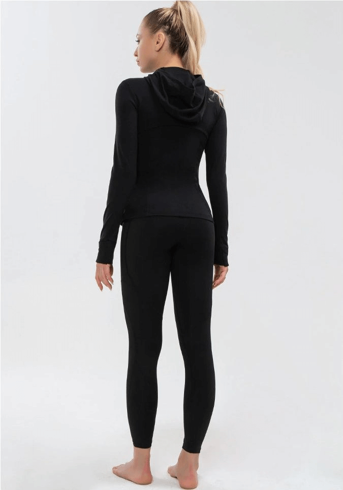 Back view of woman wearing black long-sleeves quick-drying sports shirt for yoga
